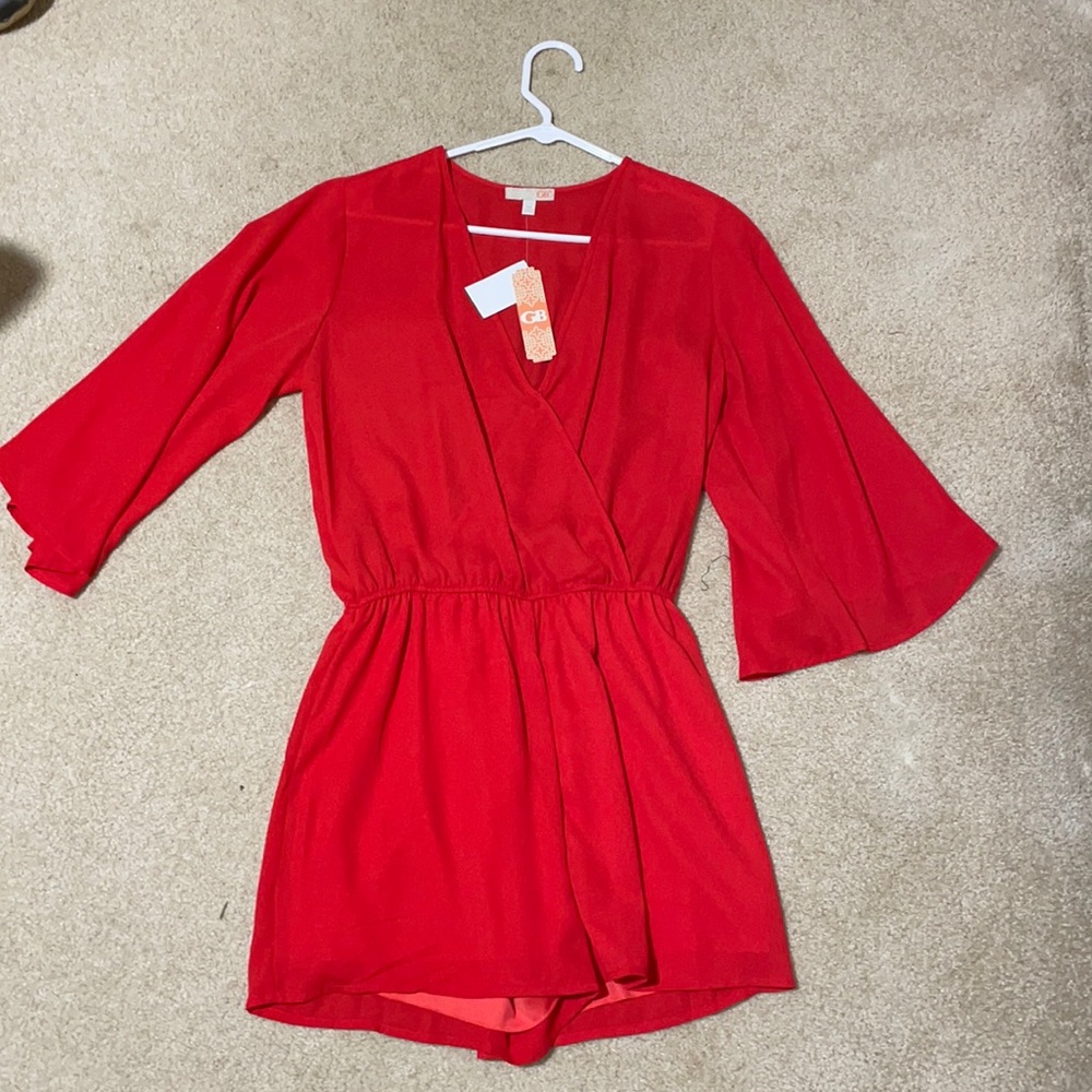 Women’s red romper in a size medium